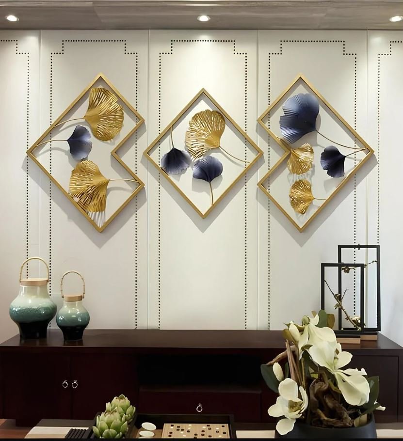Mixed metal wall art featuring gold and black finishes for living room